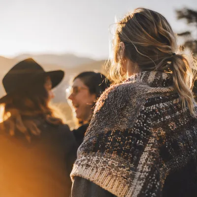 Friends Laughing Outdoors in Autumn Sunlight