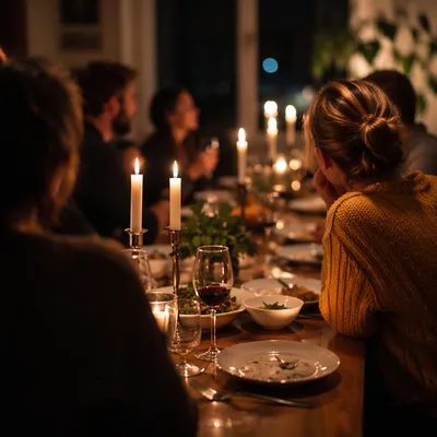 Friends Laughing at Candlelit Dinner Celebration