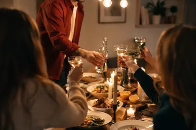 Friends Toasting at Cozy Dinner Celebration