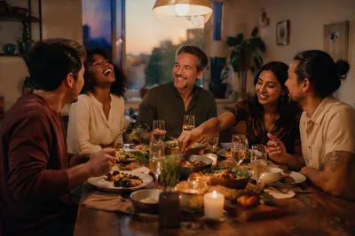Friends Laughing Around Dinner Table Celebration