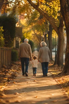 Grandparents and Grandchild Walking in Autumn