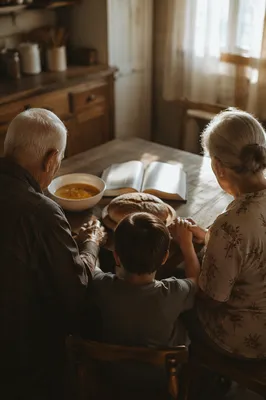 Grandparents and Grandchild Sharing Mealtime Blessing