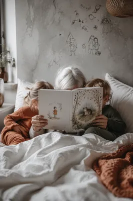 Grandparents Reading Storybook with Grandchildren in Bed