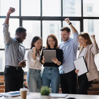 Coworkers Celebrating Success in Modern Office