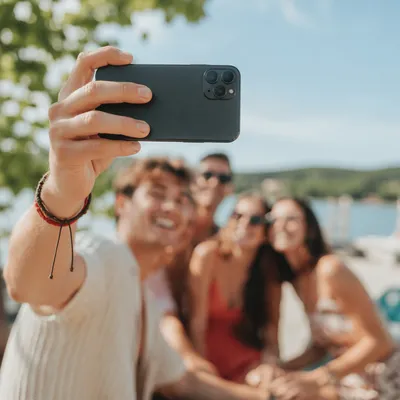 Friends Taking Sunny Outdoor Group Selfie