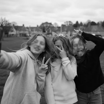 Playful Friends Taking Outdoor Selfie in Park