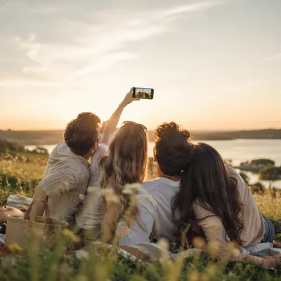 Playful Friends Selfie at Golden Lakeside