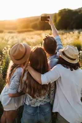 Friends Taking Selfie in Golden Meadow