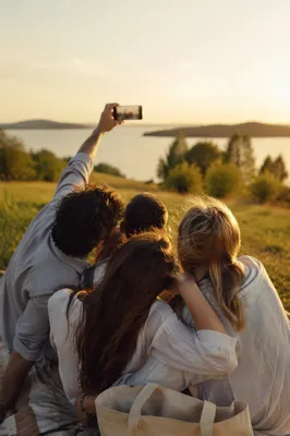 Playful Friends Selfie by Lakeside at Sunset