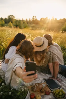 Friends Taking Meadow Selfie After Fellowship Picnic