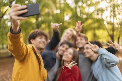 Cheerful Friends Group Selfie in Sunny Park