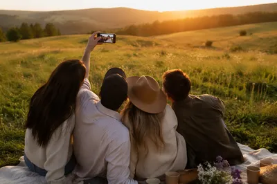 Friends Taking Golden Hour Meadow Selfie