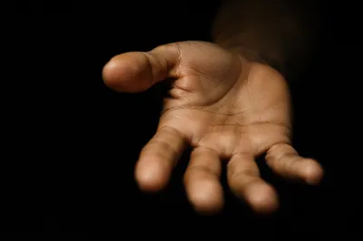 Reaching Hand in Dark Cinematic Close-Up