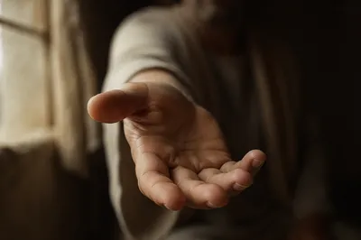 Gentle Hand Reaching Forward Close Up