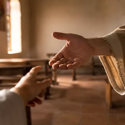 Gentle Reaching Hand in Prayer Room