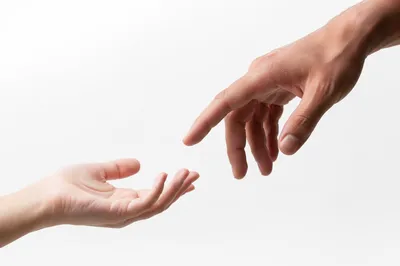 Gentle Hands Reaching in Hopeful Connection