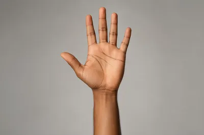 Close-Up Hand Reaching Upward Gesture