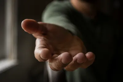 Close-Up Hand Reaching Toward Camera