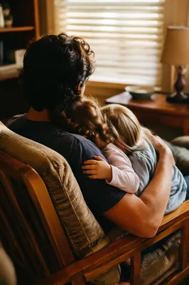 Happy Family Embrace in Cozy Living Room