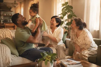 Happy Multiracial Family in Cozy Living Room
