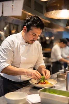 Chef Plating Dish in Restaurant Kitchen