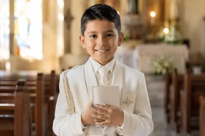 Smiling Child in First Communion Attire