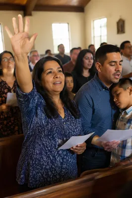 Hispanic Church Congregation Singing in Sunlight