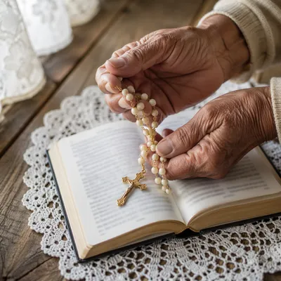 Hispanic Grandmother Hands Holding Rosary in Prayer