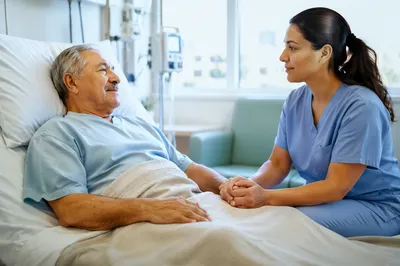 Nurse Comforting Elderly Patient in Hospital Room