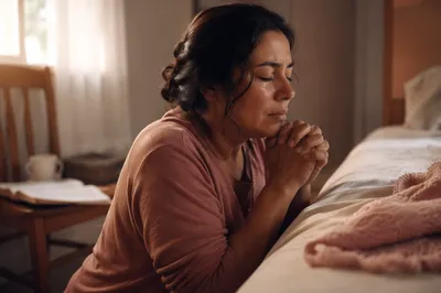 Latina Woman Praying Beside Bed at Dawn