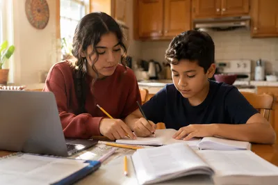 Hispanic Siblings Studying at Kitchen Table