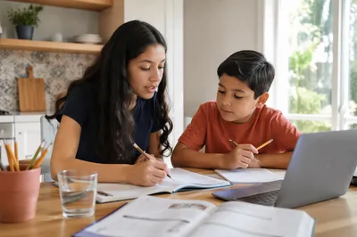 Hispanic Siblings Studying at Kitchen Table