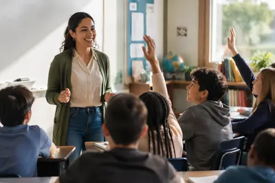 Teacher Engaging Students in Bright Classroom