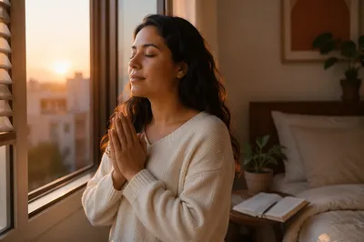 Peaceful Woman Praying by Window at Sunrise