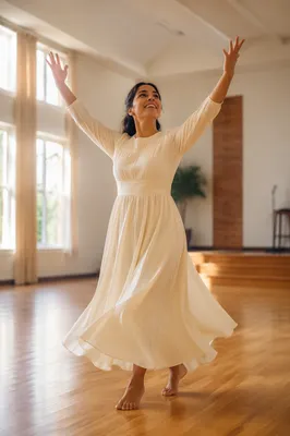Joyful Woman Dancing in Sunlit Hall