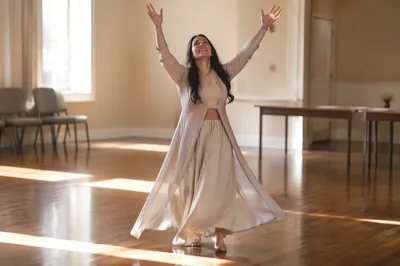 Joyful Woman Dancing in Community Hall