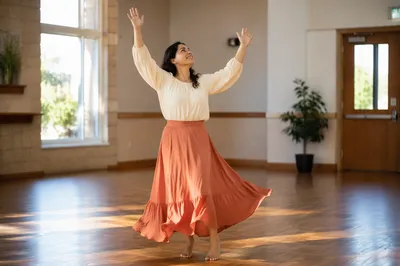 Joyful Woman Dancing in Sunlit Hall