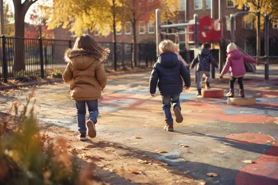 Children Playing on Autumn School Playground