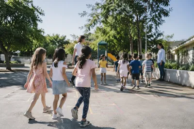 Children Playing Together on Sunny School Playground