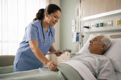 Doctor Comforting Elderly Patient in Hospital Room