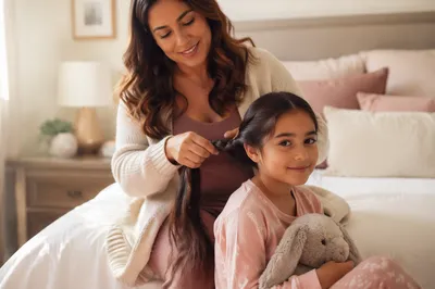 Mother Braiding Daughter Hair in Bedroom