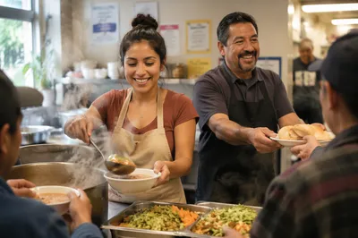 Latino Volunteers Serving Meals in Kitchen