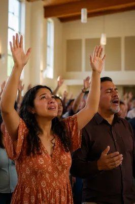 Latino Congregation Raising Hands in Worship