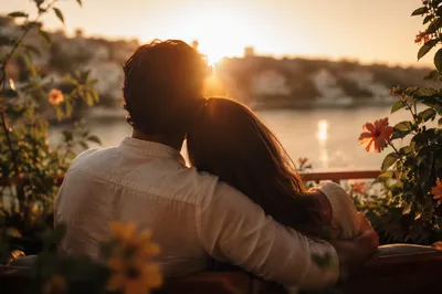 Golden Hour Couple Embracing on Balcony