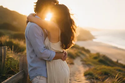 Romantic Coastal Embrace at Golden Hour