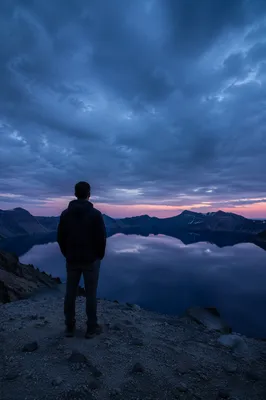 Man Alone on Mountain Overlook at Twilight