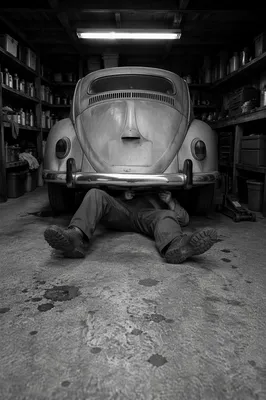 Late Night Mechanic Under Vintage Car