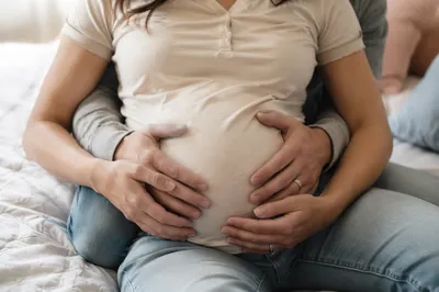 Tender Expectant Family Hands on Belly