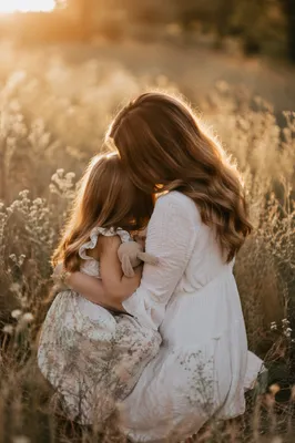 Mother and Child Embrace in Golden Meadow