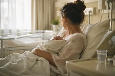 Tender Mother and Newborn in Hospital